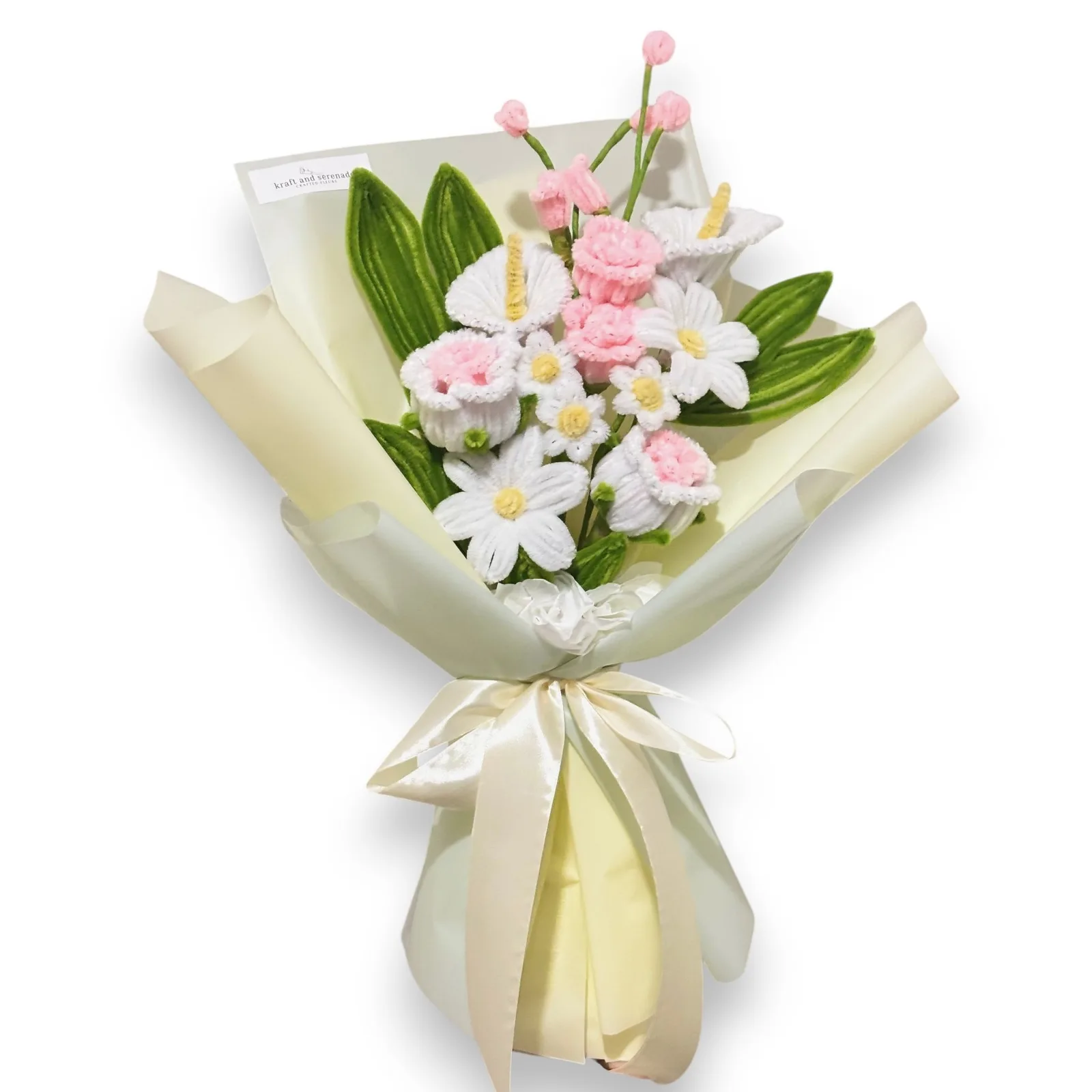 The arrangement features roses, calla lilies, daisy and small rose flowers, complemented by leaves as fillers.
