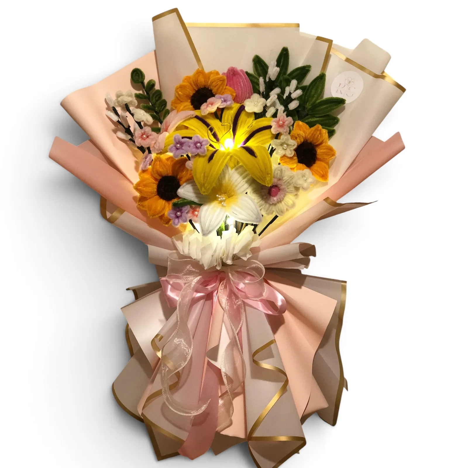 The arrangement features sunflowers, gerbera, lilies, rapunzel sundrop and tulip flowers, complemented by baby's breaths, mini daisies, and ash leaf as fillers.