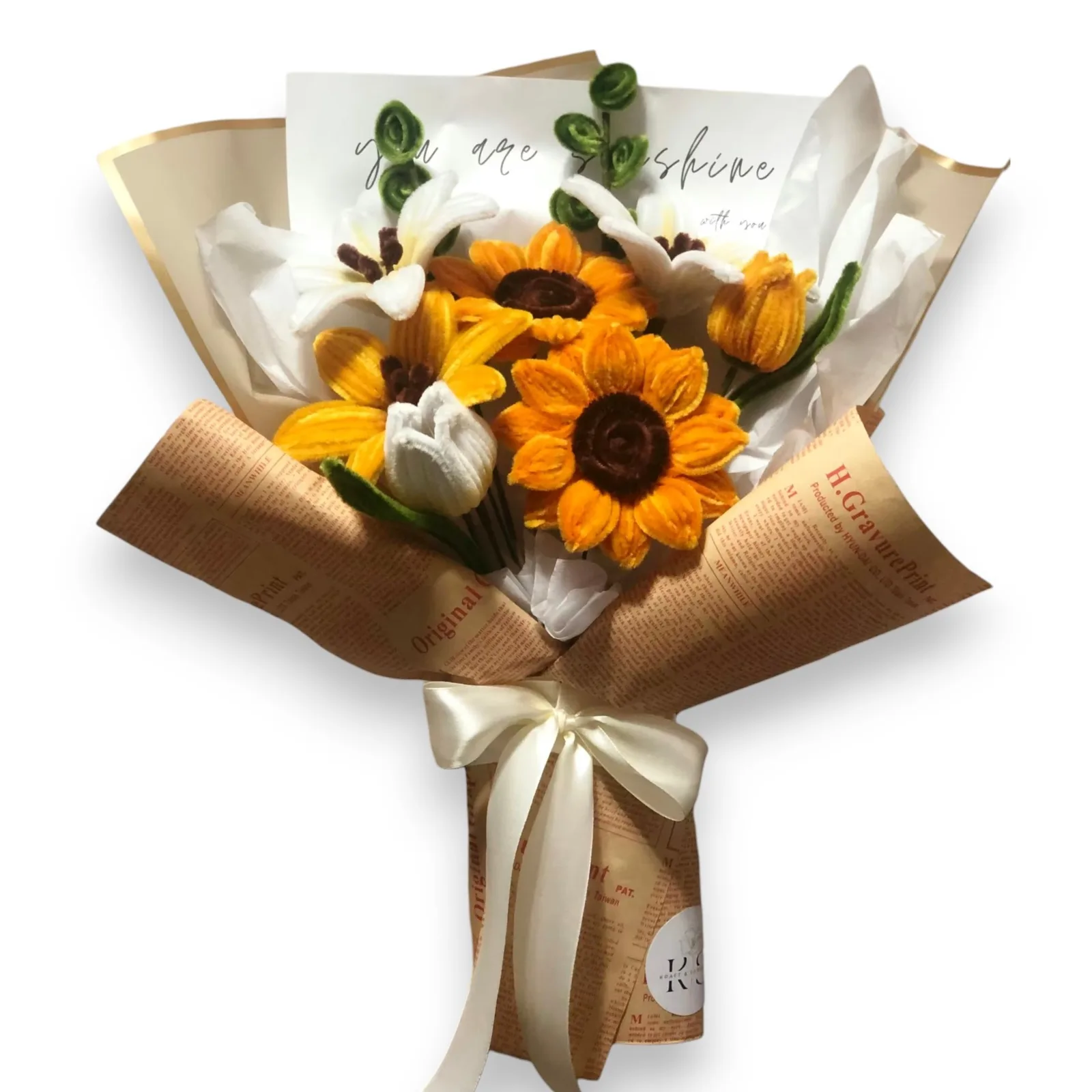The arrangement features sunflowers, lilies and tulip flowers, complemented by eucalyptus as fillers.