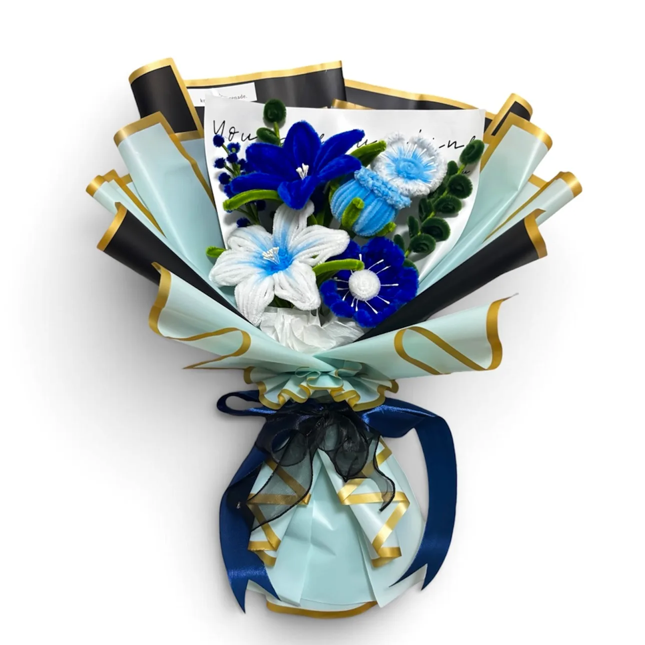 Blue signature bouquet featuring blue roses, poppies, and lilies in a cool-toned arrangement.