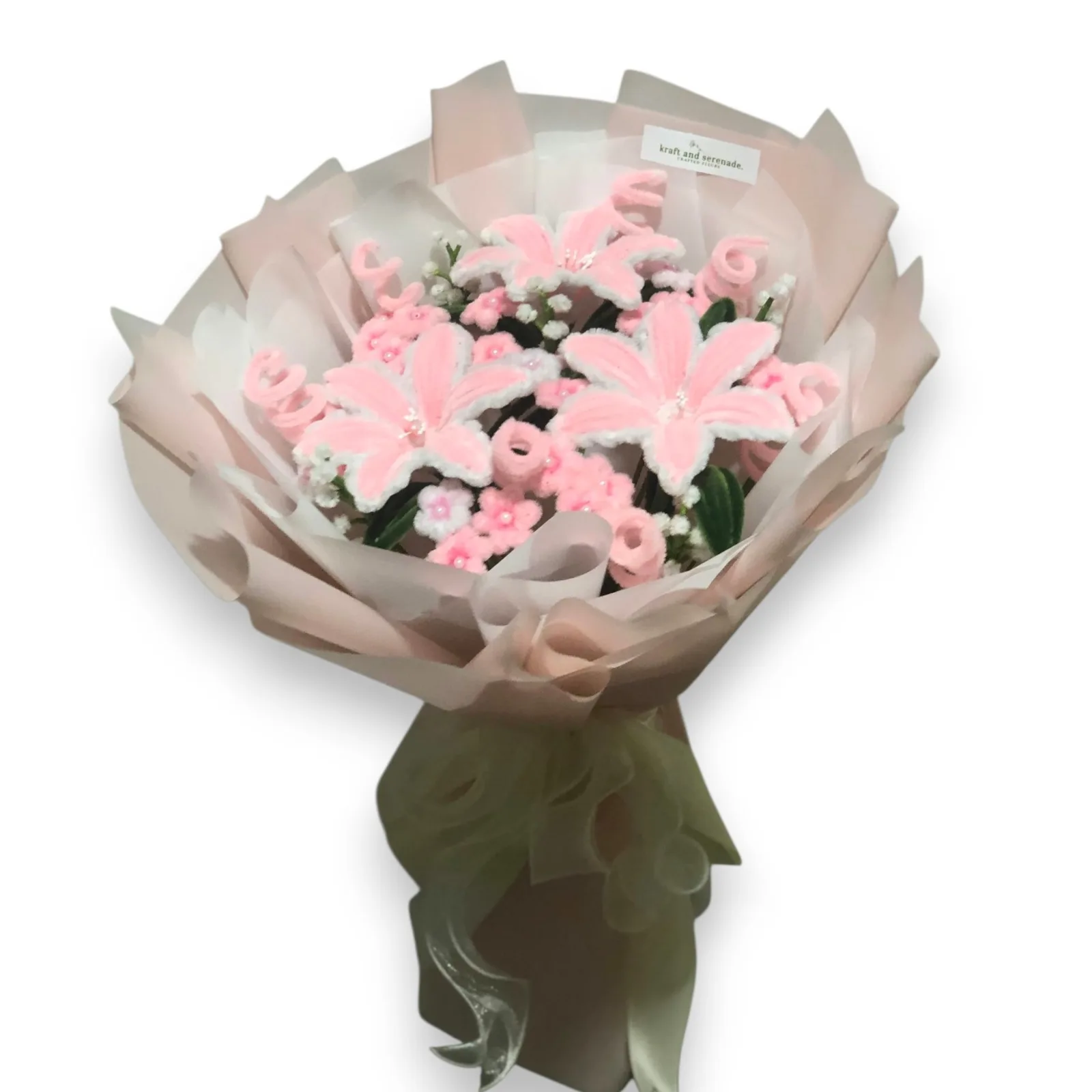The arrangement features lily flowers, complemented by mini daisies, baby's breaths and spirals as fillers.