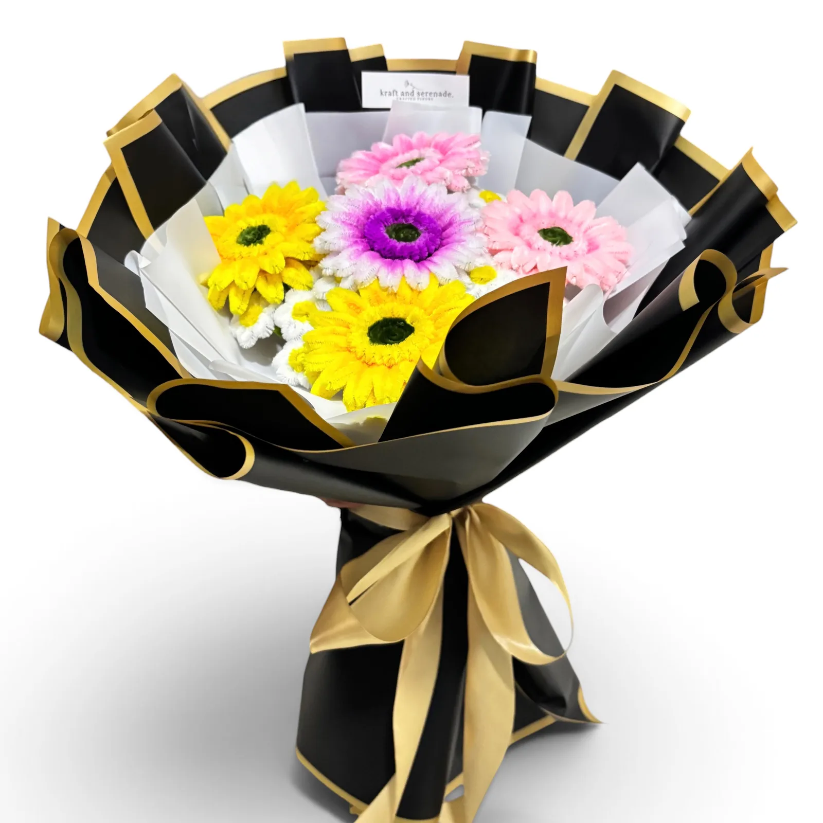 It features gerbera flowers paired with mini daisies as fillers.