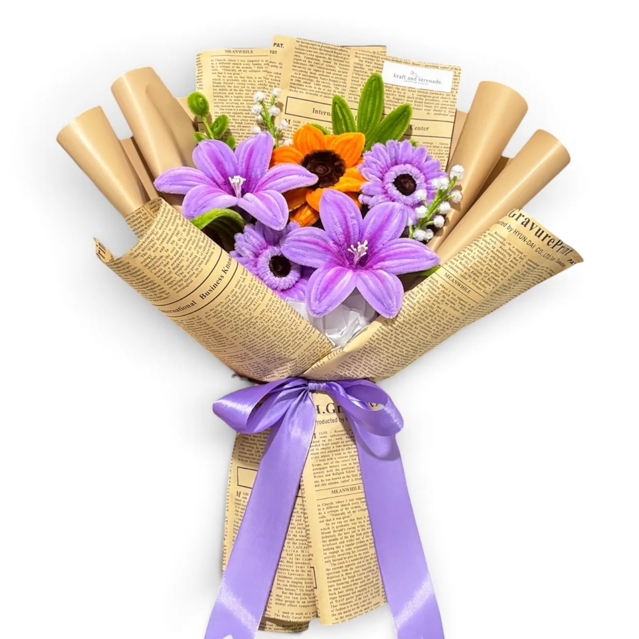 The arrangement features lilies, gerberas and sunflower flowers, complemented by flower bud as fillers.