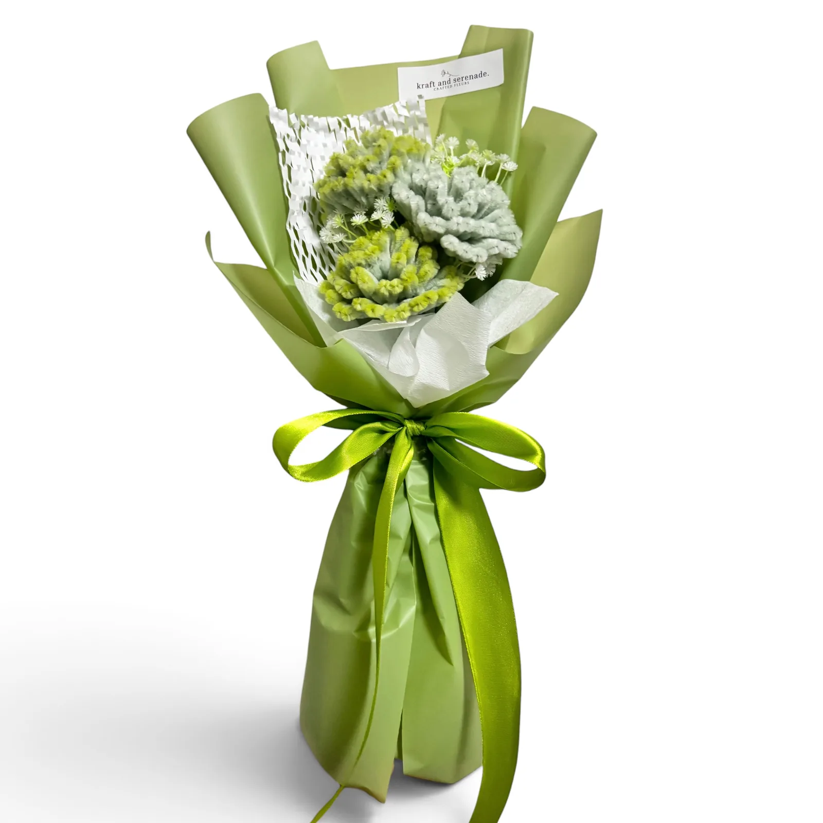 The arrangement features carnation flowers, complemented by baby's breath as fillers.